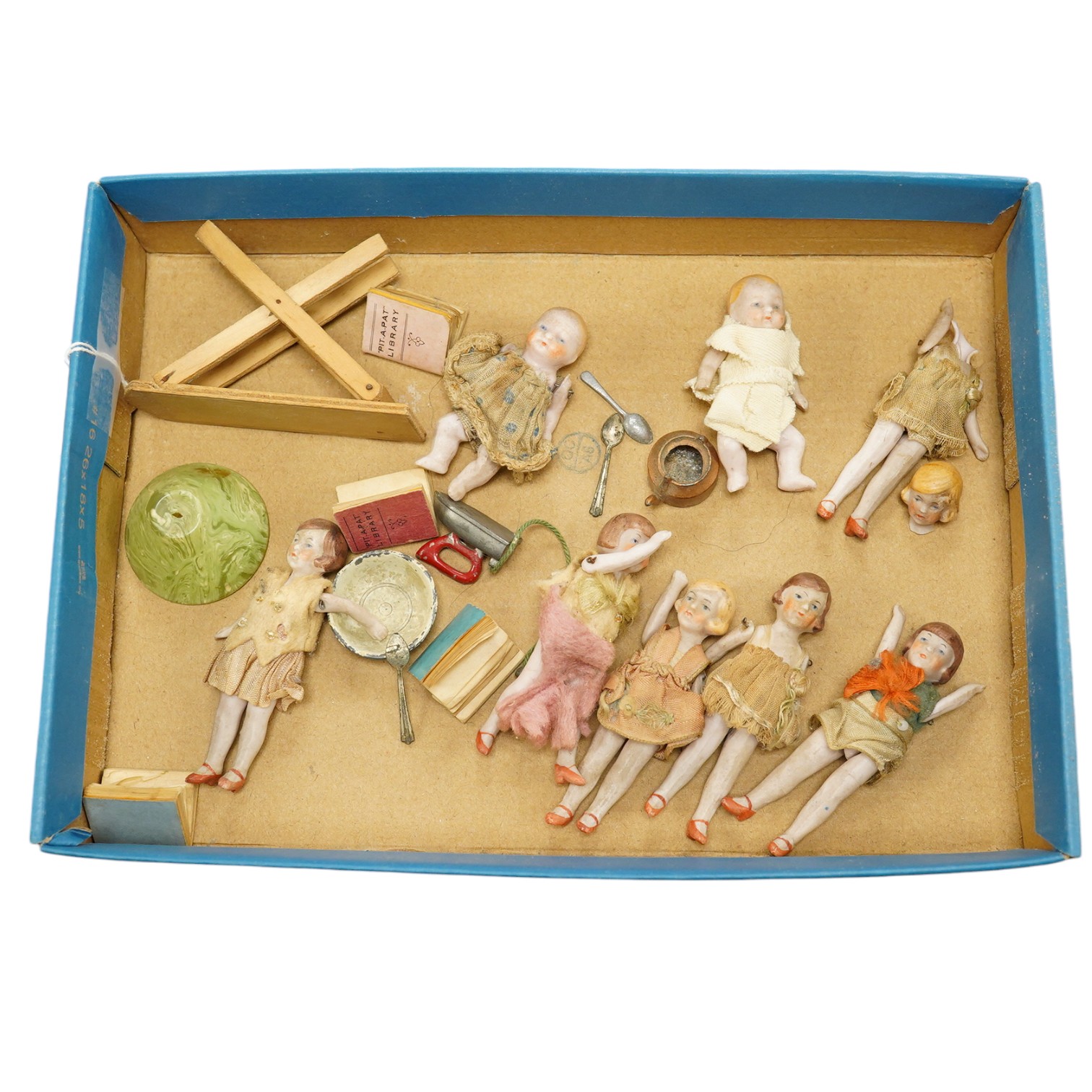 Eight early 20th century ceramic ‘doll's house’ dolls, approx 8cm long, with articulated limbs, together with a small quantity of doll house items by Pit-A-Pat series, etc. Condition - poor to fair.